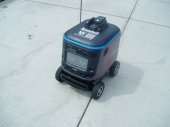 A mobile robot patrols the campus
