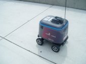 A mobile robot patrols the campus