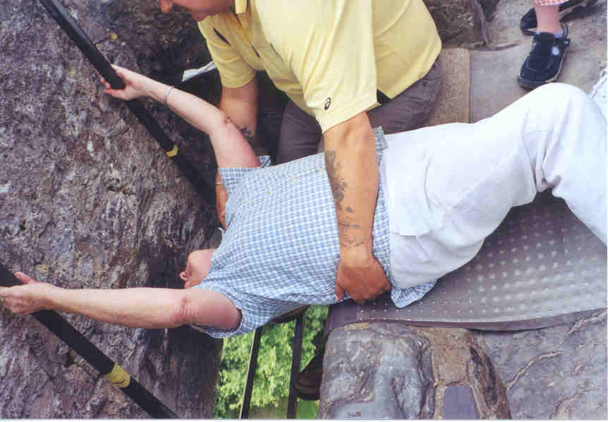 Mom attempts to kiss the Blarney Stone.  It's harder than it looks!